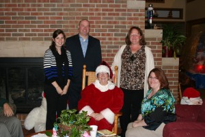 Wheaton representatives with Mrs. Claus. She had story time with the children that are staying at RMH. 