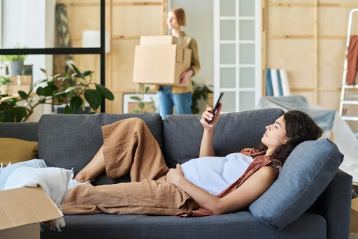 Pregnant woman on the couch.