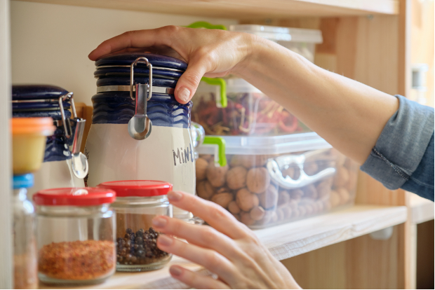 Person grabbing items out of pantry