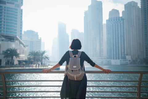 Woman looking out at a big city.