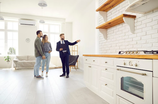 People touring a kitchen.