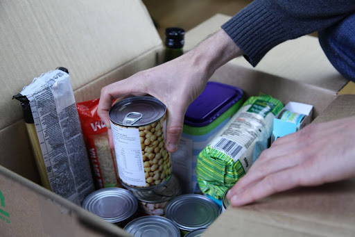 Cans of food in a box.
