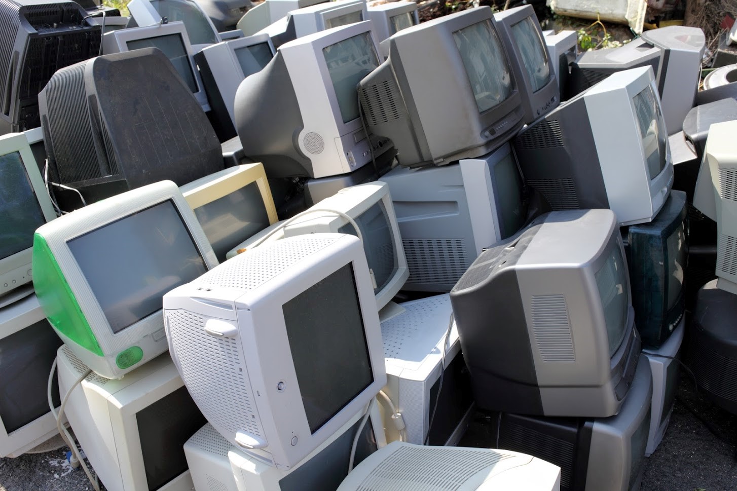 computers stacked and ready to be recycled