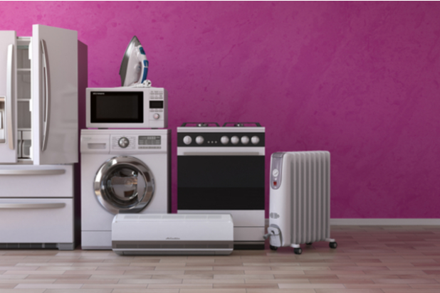 Set of household home appliances on pink background