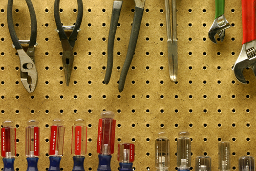 A shelf of neatly organized tools.