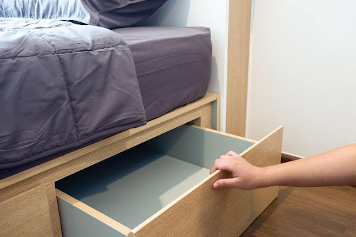 Bed with built-in drawers underneath.