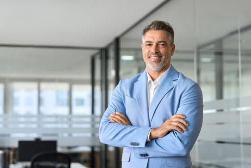 50 years old professional business man ceo investor wearing blue suit standing in office arms crossed, happy confident older businessman corporate leader executive looking at camera at work, portrait.