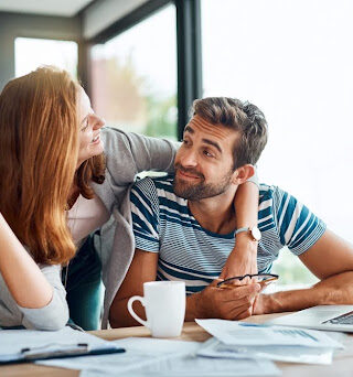 A man and woman review their moving checklist.